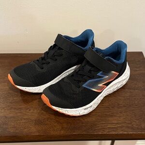 New Balance Kids Black and Blue Sneakers with Orange Accents